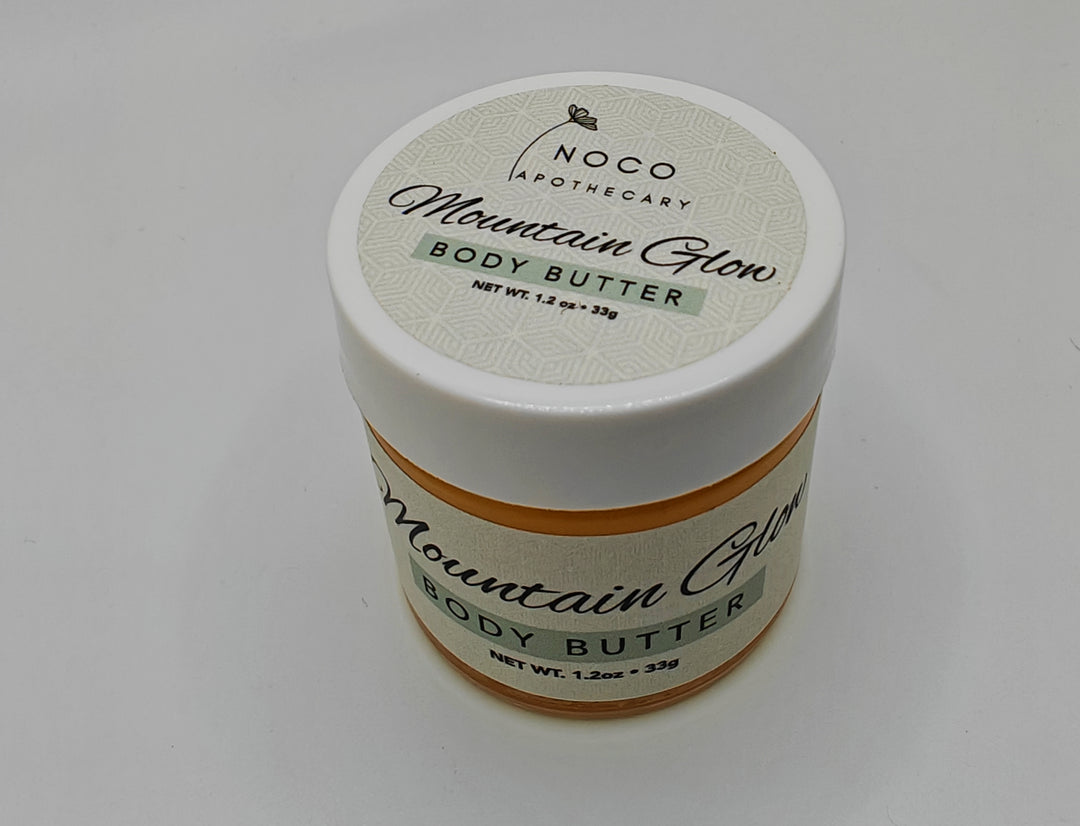 Top view of Mountain Glow Body Butter mini against white background | NoCo Apothecary | Antioxidant Lotion | Natural Lotion