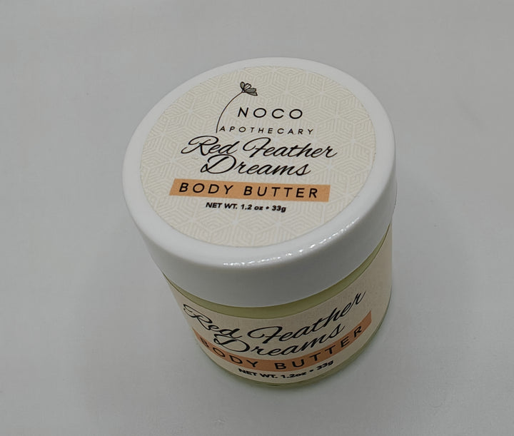 Top view of Red Feather Dreams Body Butter mini against white background | NoCo Apothecary | Natural Lotion